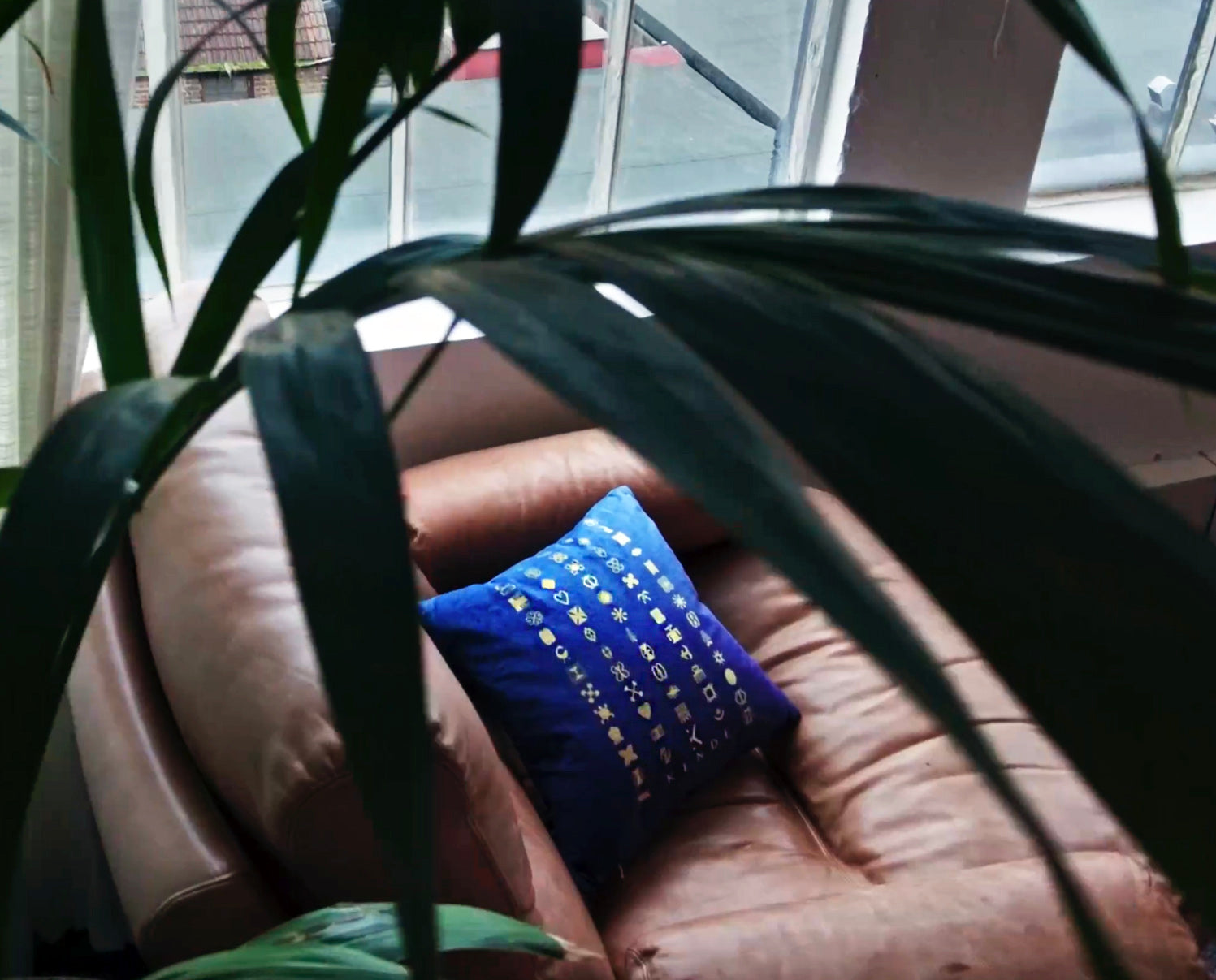 Load video: Video showing a close up of blue velvet shimmer Zemora cushion available in a range of colours at kende.co.uk